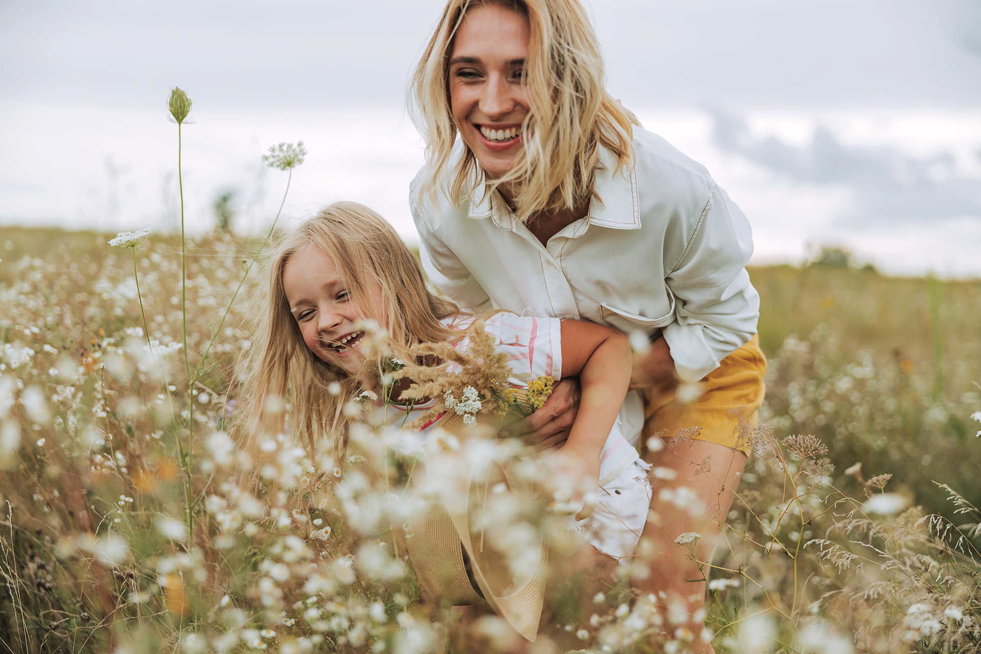 Happy woman having fun with her daughter